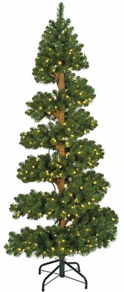 Spiral-cut artificial spruce tree lit with warm white lights, bare brown trunk, on a black wire folding stand.