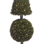 Artificial pine cone topiary strung with mini lights, with a rounded ball tier beneath the cone, in a black pot