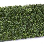 Dense green artificial boxwood hedge panel, rectangular block shape