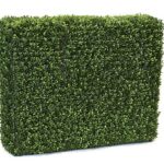Dense green artificial boxwood hedge panel shown as a rectangular block on a white background.