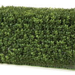 Rectangular artificial boxwood hedge section with dense green foliage, angled view