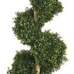 Artificial spiral topiary in an ornate faux-aged planter, photographed on white