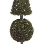 PVC pine topiary with pyramid and ball tiers, lit with small lights, in a decorative pot
