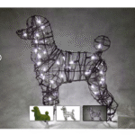 Lit wire poodle topiary frame strung with small white lights, photographed at night