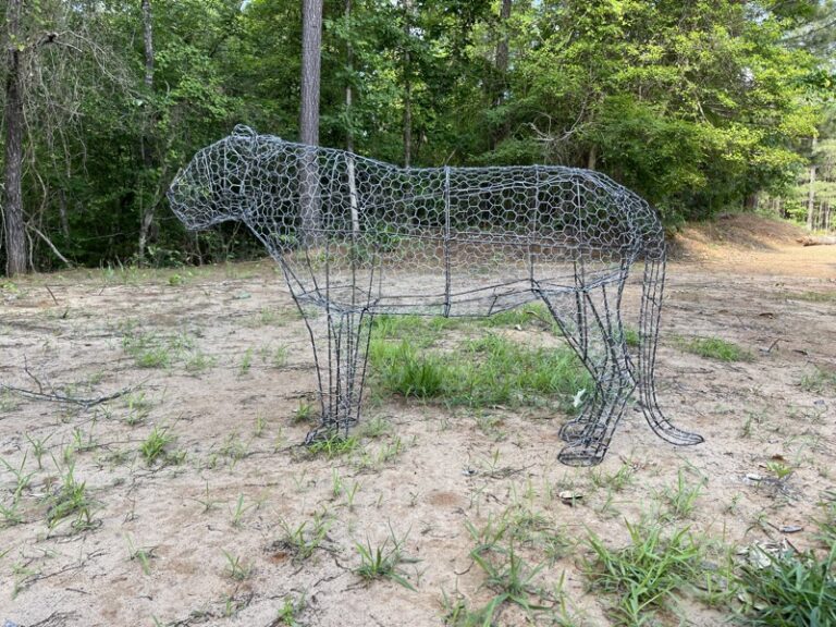 Welded steel tiger frame in a sitting pose, bare wire before foliage is applied
