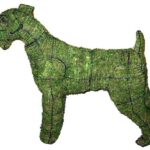 Moss-covered Airedale terrier topiary in profile, with a bearded face and upright ears