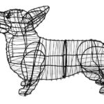 Bare wire-frame corgi topiary with upright pointed ears, shown in profile on white background.