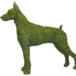 Moss-covered Doberman topiary in profile, pointed ears and dark eye detail