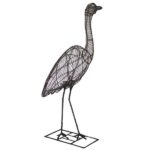 Black wire-frame topiary sculpture of a heron with a long curved neck, standing on thin wire legs.