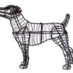 Bare black wire-frame terrier topiary, standing alert with ears up and tail raised, on a white background.