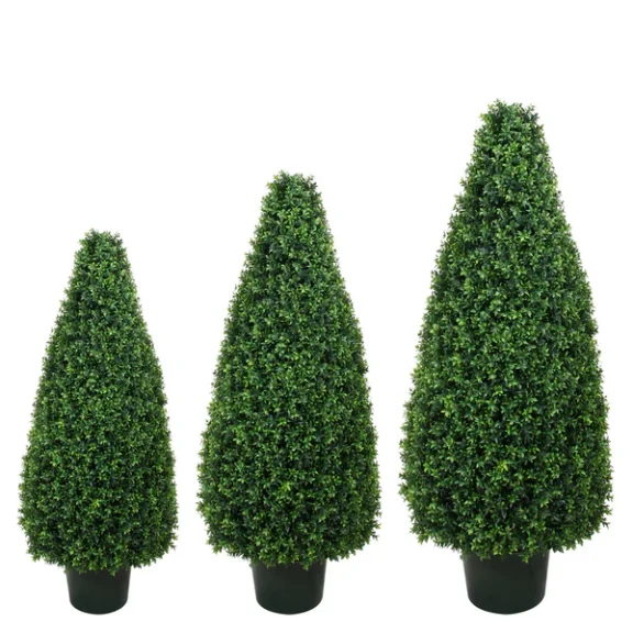 Three artificial cone topiaries in black pots, graduated small to large, on a white background