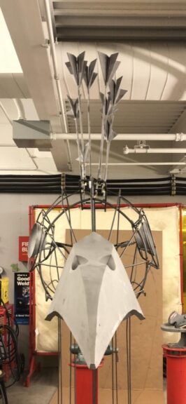 Metal tail-feather pieces and wire body frame for the peacock topiary