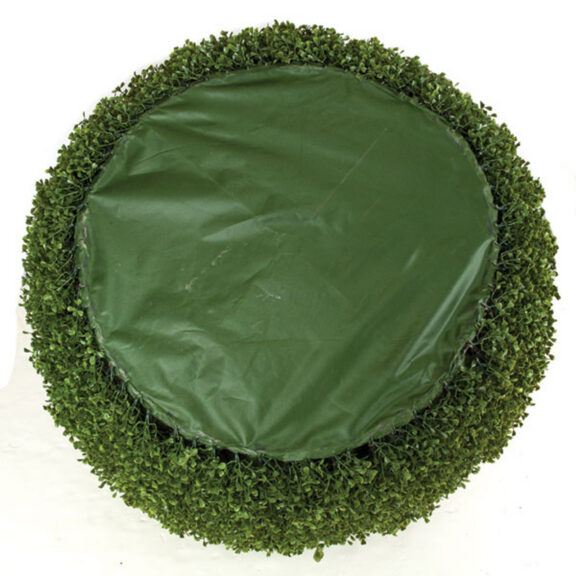 Top view of the boxwood ball topiary showing a fabric base cover ringed by foliage.
