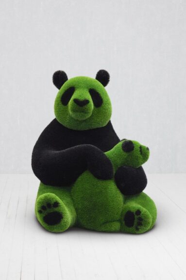 Panda holding a baby panda, topiary sculpture covered in turf