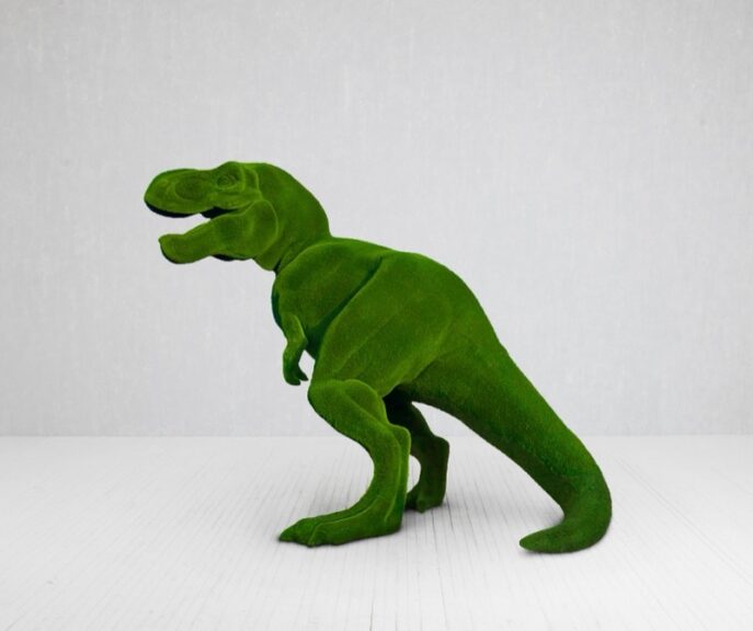 Dinosaur-shaped statue with a green, velvet-textured surface and smooth, rounded body.