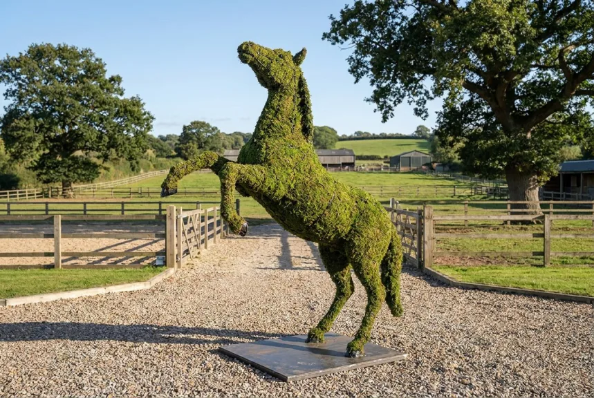 Concept rendering of a life-size rearing moss horse on a steel base at an arena entrance