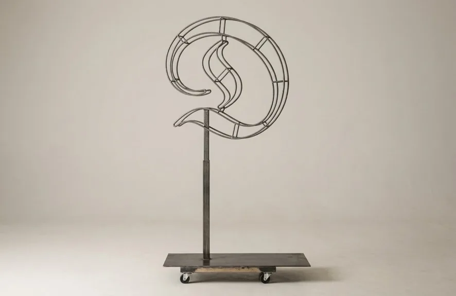 Monogram letter D topiary frame in Custom style, bare galvanized steel on an adjustable stand