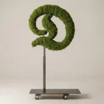 Monogram letter D topiary in Custom style, packed with green moss, on an adjustable stand