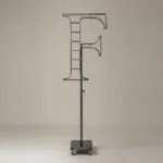 Monogram letter F topiary frame in Roman style, bare galvanized steel on an adjustable stand