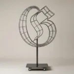 Monogram letter G topiary frame in Custom style, bare galvanized steel on an adjustable stand