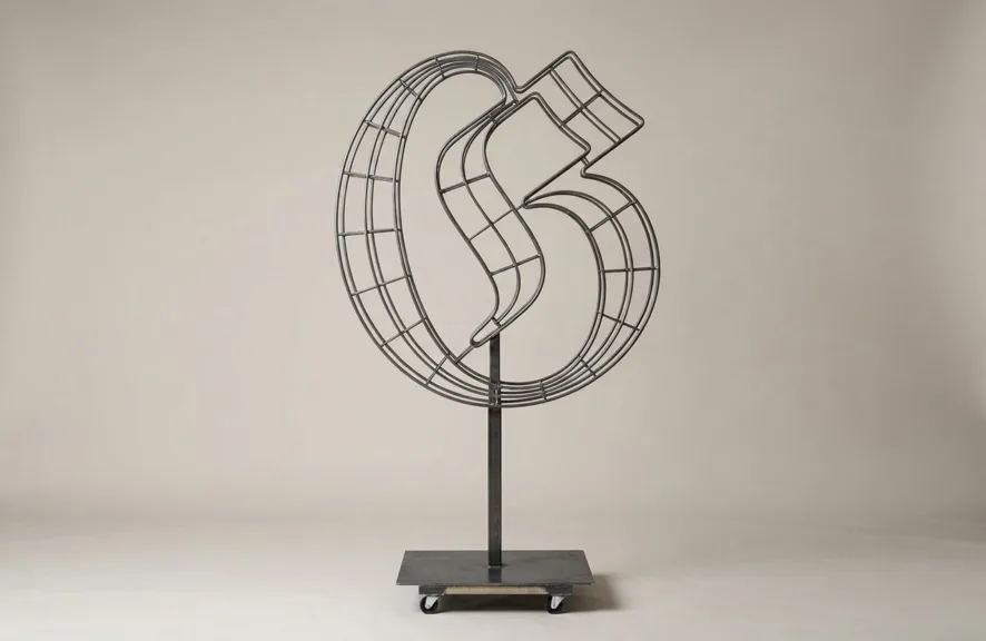 Monogram letter G topiary frame in Custom style, bare galvanized steel on an adjustable stand