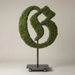 Monogram letter G topiary in Custom style, packed with green moss, on an adjustable stand