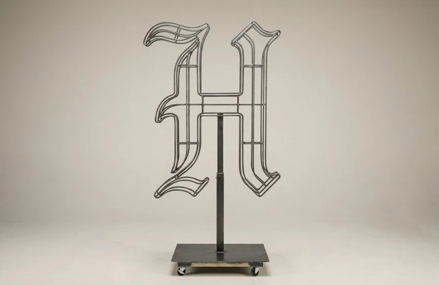 Monogram letter H topiary frame in Custom style, bare galvanized steel on an adjustable stand