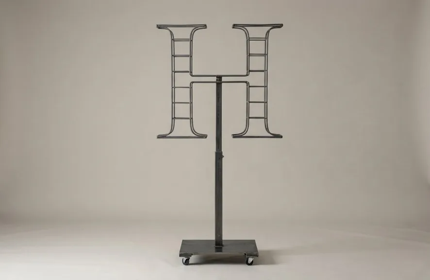 Monogram letter H topiary frame in Roman style, bare galvanized steel on an adjustable stand
