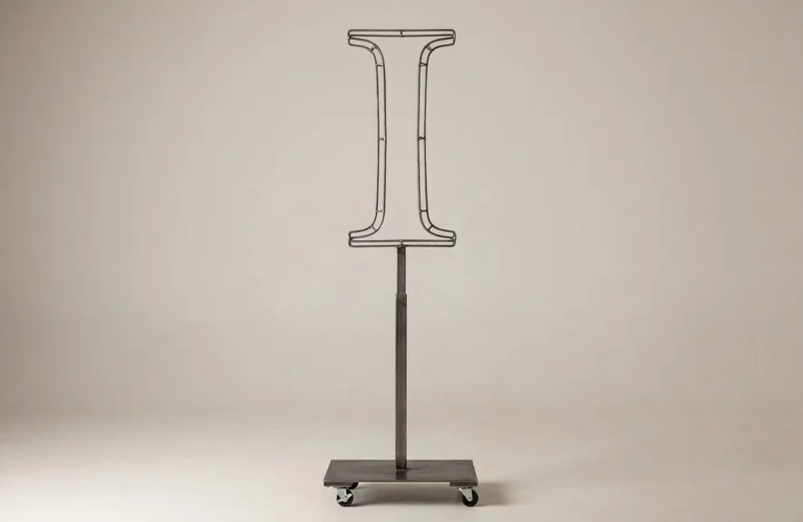 Monogram letter I topiary frame in Cinzel style, bare galvanized steel on an adjustable stand