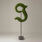 Monogram letter J topiary in Custom style, packed with green moss, on an adjustable stand