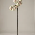 Monogram letter J topiary in script style, covered in pink and white roses