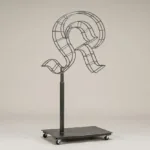 Monogram letter K topiary frame in Custom style, bare galvanized steel on an adjustable stand