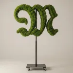 Monogram letter M topiary in Custom style, packed with green moss, on an adjustable stand