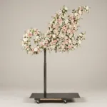 Monogram letter M topiary in script style, covered in pink and white roses