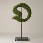 Monogram letter O topiary in Custom style, packed with green moss, on an adjustable stand