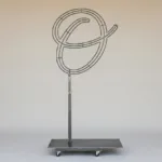 Monogram letter O topiary frame in Flowing script style, bare galvanized steel on an adjustable stand