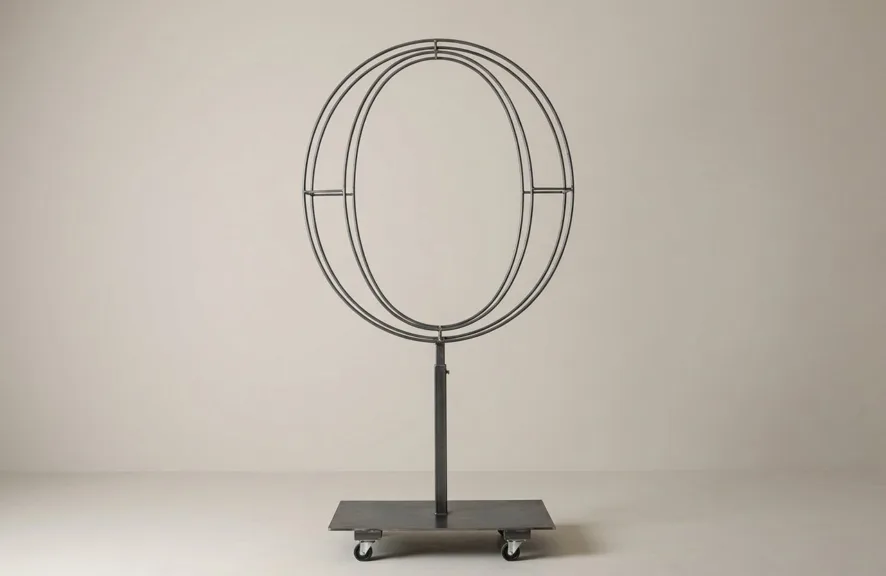 Monogram letter O topiary frame in Roman style, bare galvanized steel on an adjustable stand