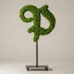 Monogram letter P topiary in Custom style, packed with green moss, on an adjustable stand