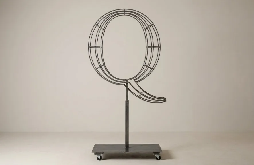 Monogram letter Q topiary frame in Roman style, bare galvanized steel on an adjustable stand