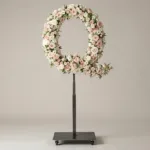 Monogram letter Q topiary in script style, covered in pink and white roses