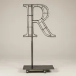 Monogram letter R topiary frame in Roman style, bare galvanized steel on an adjustable stand