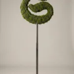 Monogram letter S topiary in Custom style, packed with green moss, on an adjustable stand