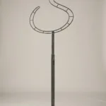 Monogram letter S topiary frame in Flowing script style, bare galvanized steel on an adjustable stand