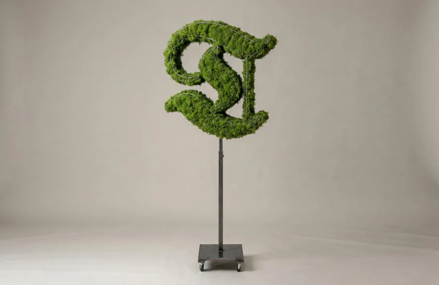Monogram letter T topiary in Custom style, packed with green moss, on an adjustable stand