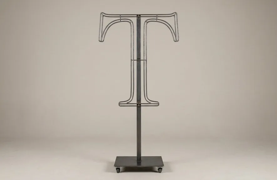 Monogram letter T topiary frame in Roman style, bare galvanized steel on an adjustable stand