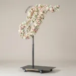 Monogram letter T topiary in script style, covered in pink and white roses