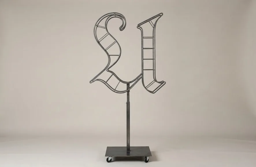 Monogram letter U topiary frame in Custom style, bare galvanized steel on an adjustable stand