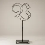 Monogram letter V topiary frame in Custom style, bare galvanized steel on an adjustable stand