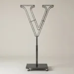 Monogram letter V topiary frame in Roman style, bare galvanized steel on an adjustable stand