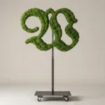 Monogram letter W topiary in Custom style, packed with green moss, on an adjustable stand